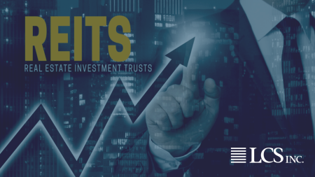 REITS in large gold text above a growing line graph. In the background a person wears a business suit with the cityscape behind them.