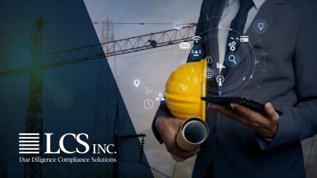 Person in a suit holding rolled-up blueprints, a hardhat, and a tablet with technological graphics overlaid.