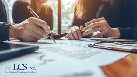 Close-up of agency professionals carefully reviewing documents related to SBA, HUD, Fannie Mae, and Freddie Mac Due Diligence processes.