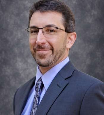 graphic with a headshot and text for Keith Spolan bio as Senior Vice President of Environmental Due Diligence.